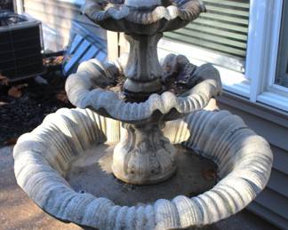 Patio table with eight swivel arm chairs w/umbrella stand.