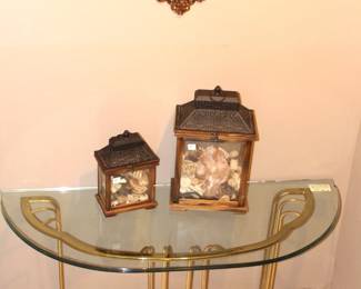 Glass top table. (chip on side edge) sea shells, small wall mirror.