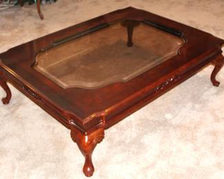 Glass top coffee table. 54" L x 40" W x 15 1/2" H.