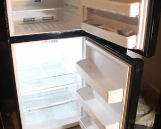 Black Frigidaire Refrigerator w/top freezer.