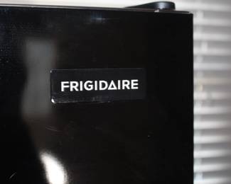 Black Frigidaire Refrigerator w/top freezer.