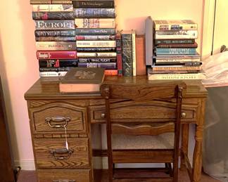 This small desk is clearly strong enough to support all these books.