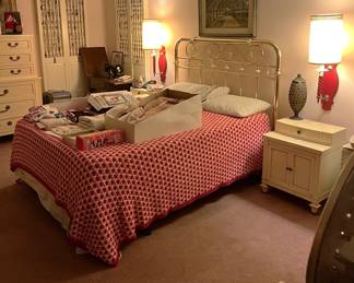 There is, as you can see, a queen-sized bedframe, a pair of nightstands, and bedding.