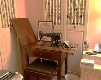 This Singer sewing machine is electric, not a treadle.  