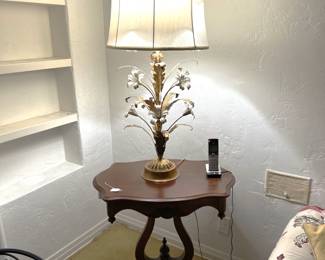 Here you can see a very nice table lamp that doubles as a flower vase.  Of course, don't discount the side table underneath the lamp.