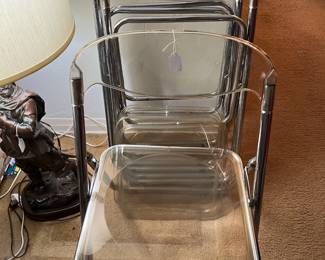 Clear plastic folding chairs?  Now I've seen everything.  There are four of them here.