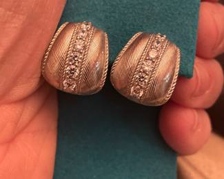 Like new pair of Judith ripka sterling cz pierced earrings   If its designer and well known we may have a few pieces to add to the mix :) 