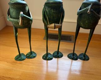 three musical metal frogs