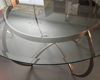 From Carson's in Archdale, NC round glass table on stainless steel base