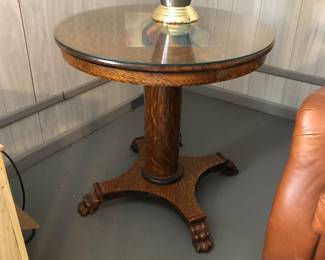 Antique tiger oak round pedestal table with glass top