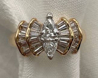 14K yellow gold diamond ring, 2 trillion cut diamonds in center, flanked by two stepped rows of baguette cut diamonds