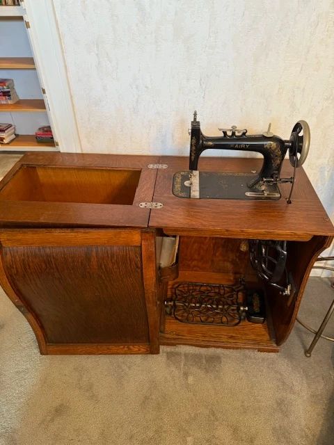 Opened cabinet for rare Secor Fairy Treadle Sewing machine