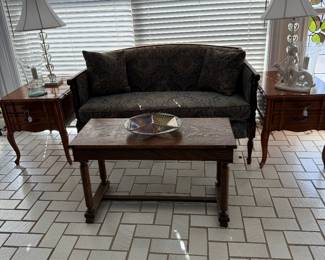 Piano stool, wooden and covered couch, end tables and glass lamps