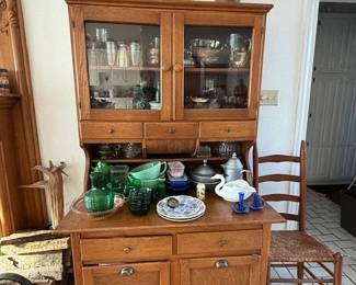Hoosier cabinet, many dishes and decor, oak caned chairs and other oak chairs