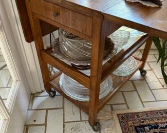 Rolling oak buffet or dessert table with lift sides