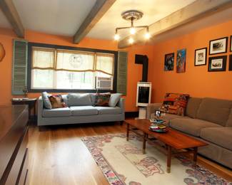 Sofas, coffee table, pop up TV cabinet, artwork, rugs