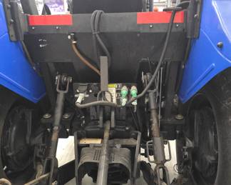 New Holland TD5050 tractor with Custom mowing wheels