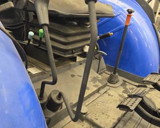 New Holland TD5050 tractor with Custom mowing wheels