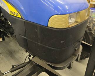 New Holland TD5050 tractor with Custom mowing wheels