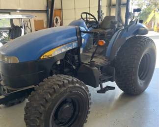 New Holland TD5050 tractor with Custom mowing wheels 4-wheel drive