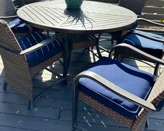 #28 - $275 - Round metal table w/6 chairs 33"Hx5'R   Chairs 39"Hx25"x25  as is (wear on top)
