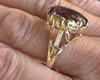 #117 - $450 - Large Amethyst ring on yellow gold with elephant carved on setting on 10kt gold. 