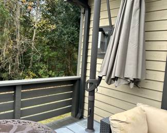 #29 - $450 - Cantilever umbrella w/light 106"H w/base - Tan 