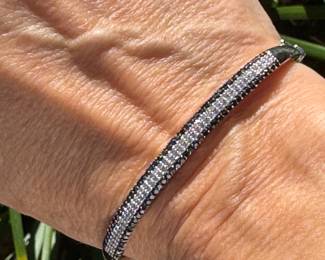 #120- $450 - black and white diamonds bangle bracelet white gold. 10kt gold. 