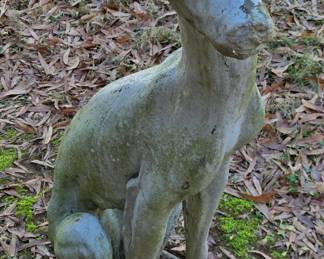 Pair of tall concrete dogs