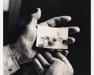 111 . Bill McDowell "Robert Shatzel Holding Fraudulent Spirit Photographs" Gelatin Silver Print (1996)