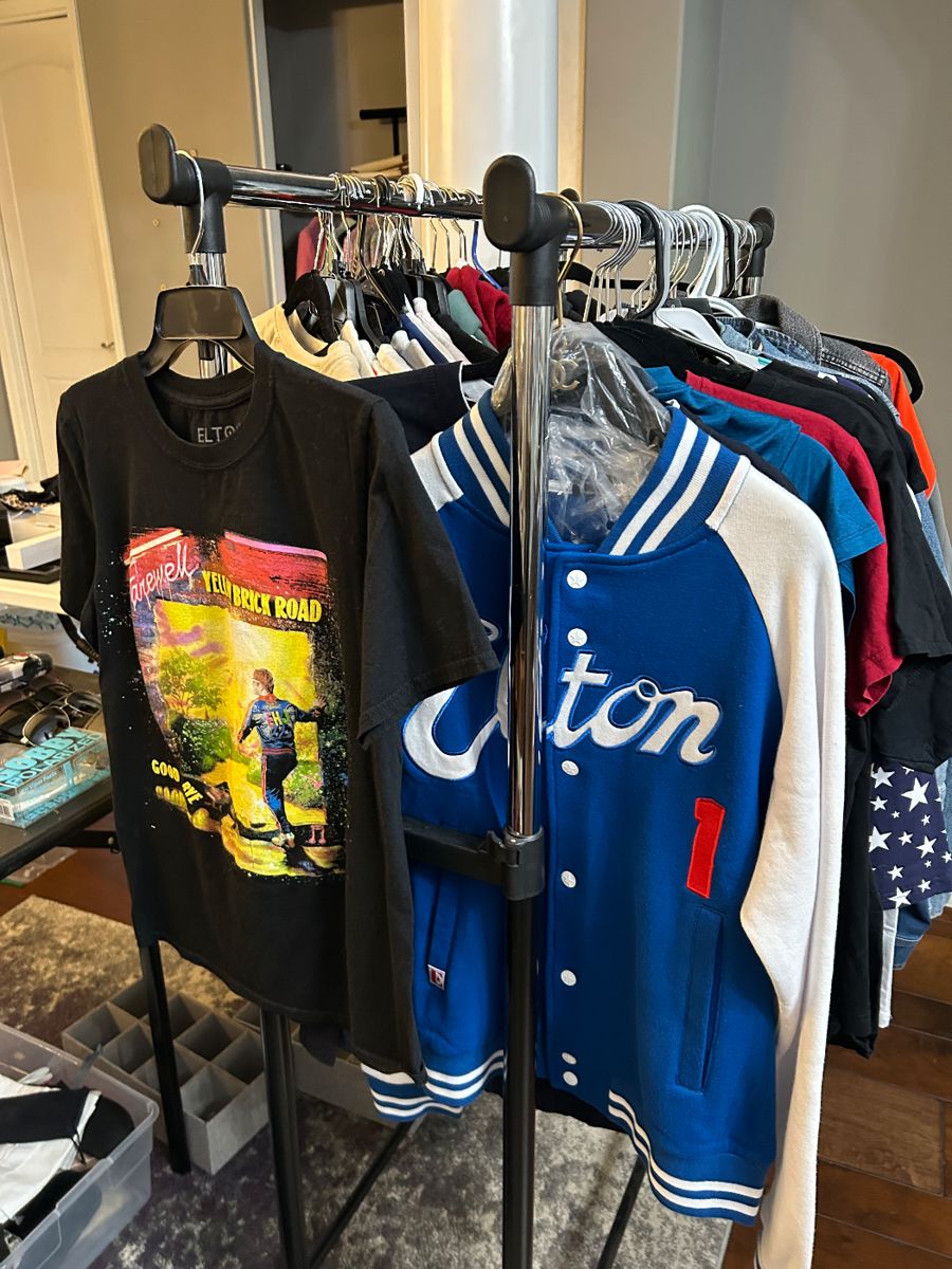 Elton John clothing next to Paris shirts - this is only one rack. There are Chanel pajamas and a bunch of cool hoodies in other rooms.