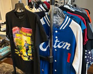 Elton John clothing next to Paris shirts - this is only one rack. There are Chanel pajamas and a bunch of cool hoodies in other rooms.