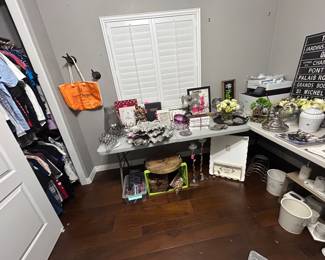 Bedroom 4 has more bougie, blingy Parisian niceties - with clothes in the closet.