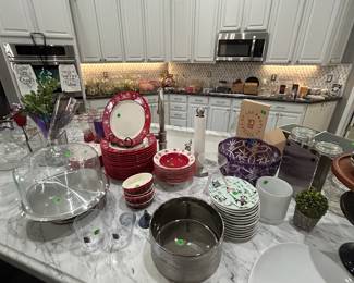 Beautiful glassware on the kitchen island and below the cabinets.
