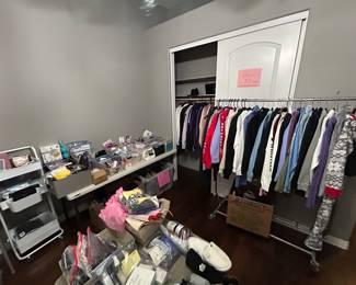 Hoodies, more women's sundries, filling an entire bedroom.