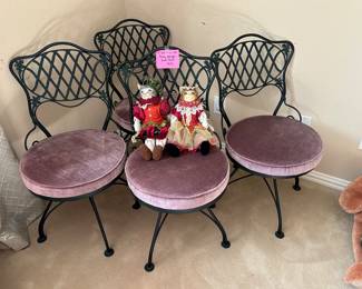 Or heavy swivel wrought iron chairs