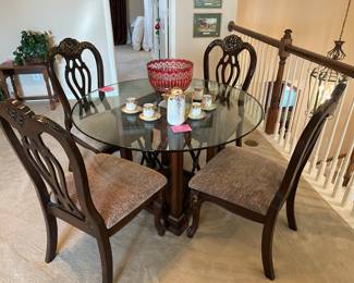 48 inch round beveled glass table and four chairs