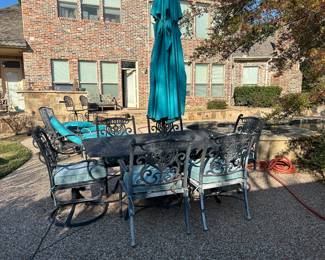 Outdoor patio set with umbrella and umbrella stand