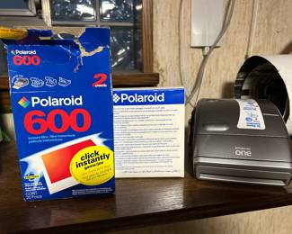 vintage Polaroid with supplies