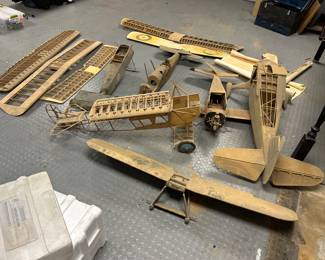 An amazing collection of giant Balsawood antique airplanes they come with the instructions rolled up and only one has an engine. They’re like about 5 feet long and wingspan is like 5 feet long. They’re really amazing.