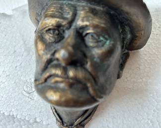 this is a signed really detailed amazing 4 1/2 inch tall bronze sits flat against the wall 3-D plaque. It’s signed and it’s signed on the back and it’s 16 out of out of 100.