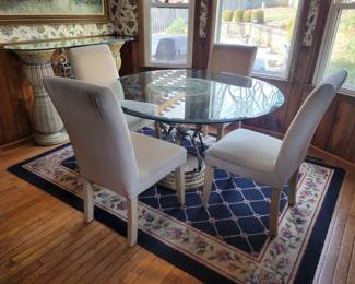 Glass top kitchen table and side table...rug not for sale
