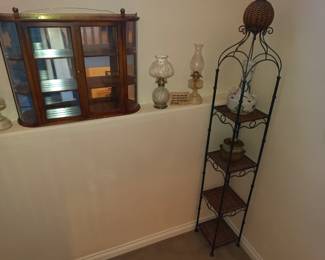Oil lamps and wall hanging curio cabinet