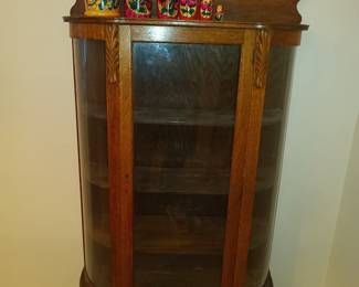Matryoshka doll and curved glass front curio