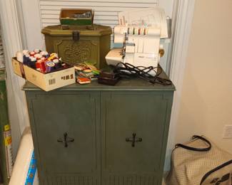 Sewing cabinet (or small bar?), sewing items and surger machine