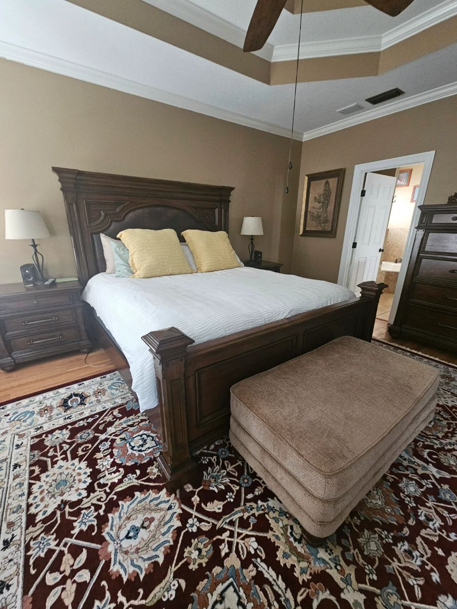 Solid wood king size bed with headboard, footboard and side boards.