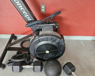 Concept 2 rowing machine with dumbells