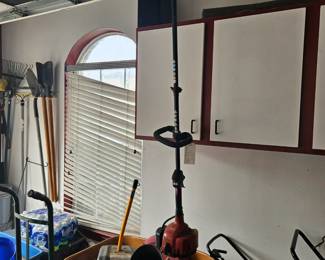 wheel barrel, weed whacker, hand cart