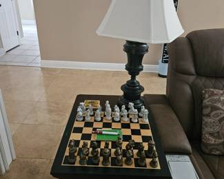 solid wood end table with lamp and chess board