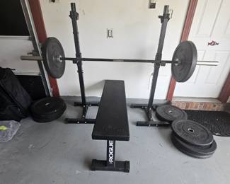 weight bench with universal bar and six 45-pound plates